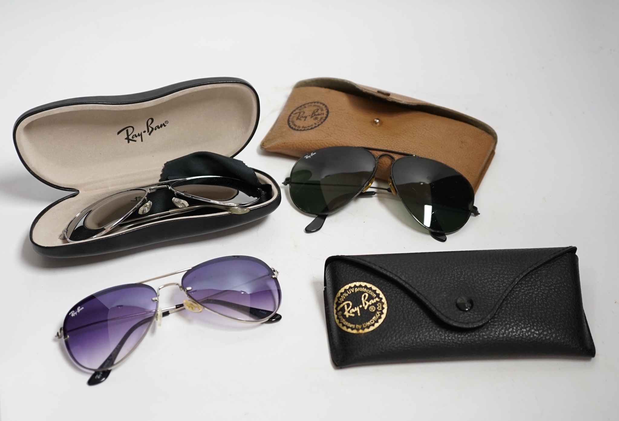 A collection of vintage Ray-Bans and other sunglasses